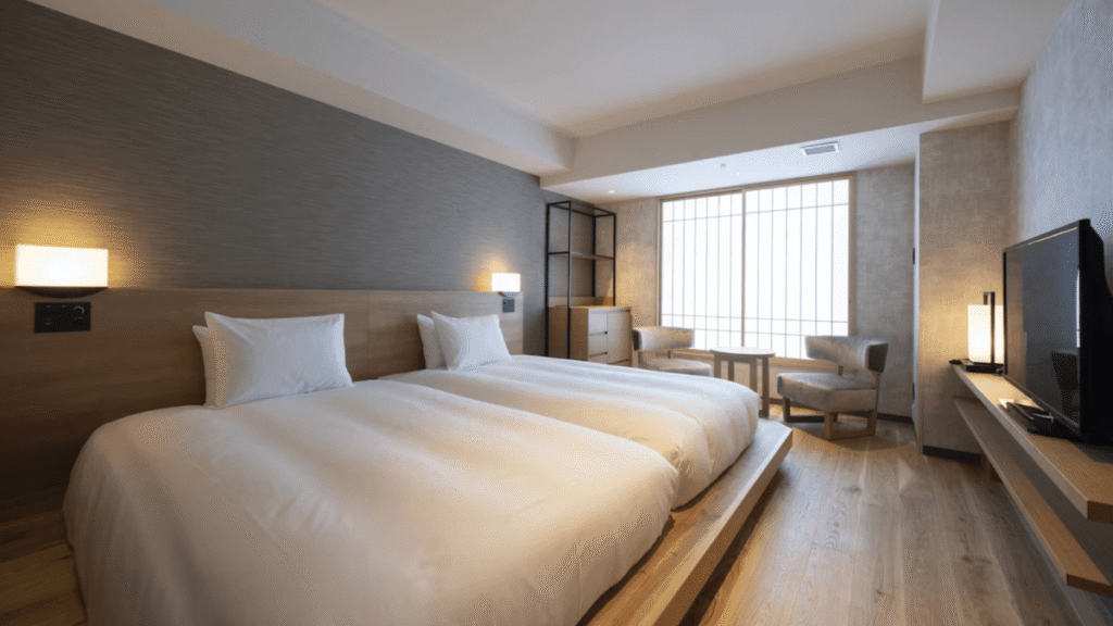 A shoes-off style guest room at Umekoji Potel Kyoto. Safe and clean for toddlers, with rental baby guards and diaper bins available.