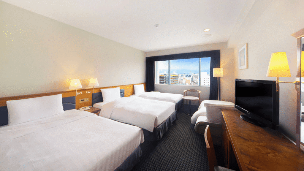 Spacious family room at Hotel Nikko Nara with multiple western beds. Clean and comfortable accommodation perfect for families traveling with children in Nara.