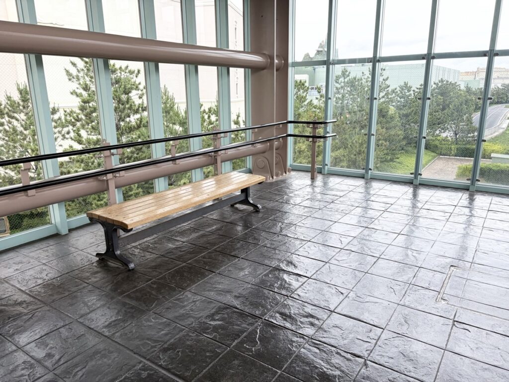 Bayside Station waiting bench at the front of the platform — best spot to get front seats on the Disney Resort Line