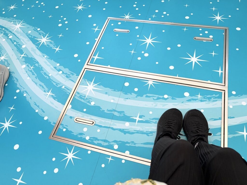 Disney Resort Line 25th anniversary sparkling floor decoration — looks like standing on water