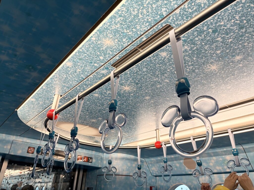Disney Resort Line clear Mickey handrails on the ceiling — 25th anniversary decoration