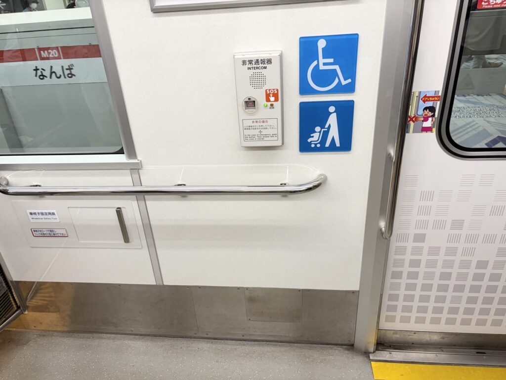 Stroller space on the Osaka Midosuji Line subway — doors have dedicated stroller areas
