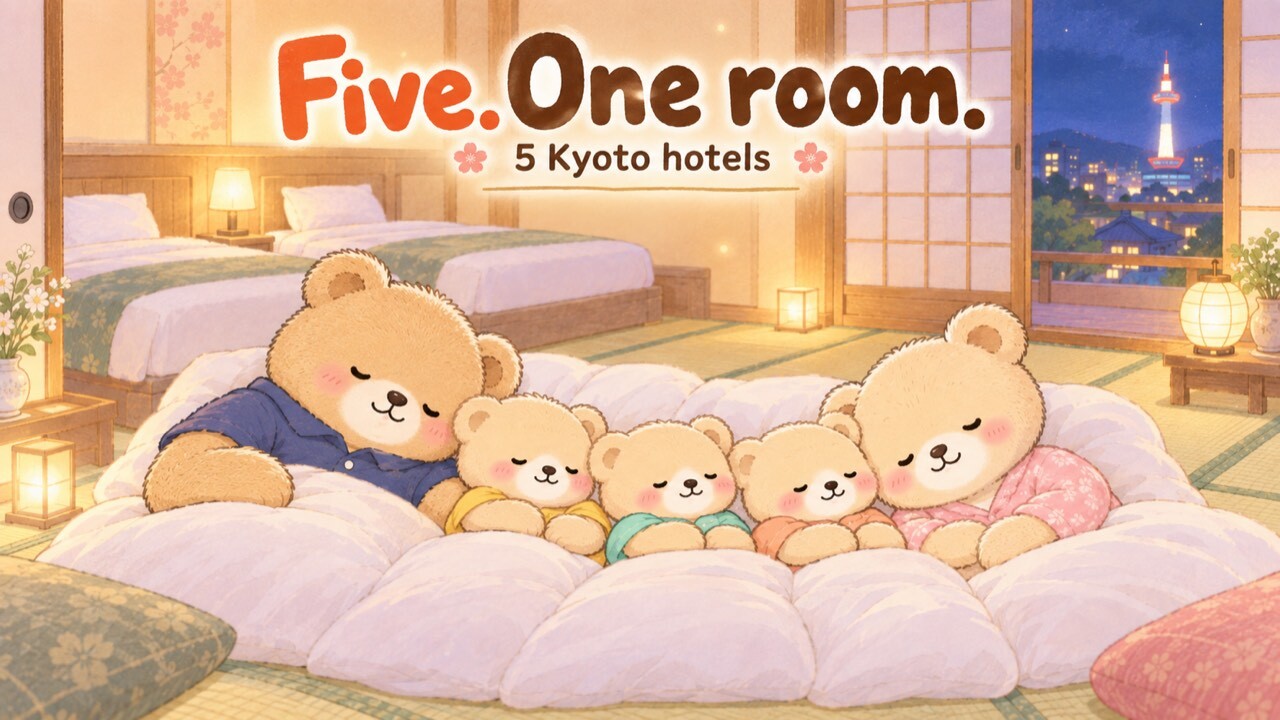 A family of five teddy bears asleep side by side on futons in a tatami room at a Kyoto hotel, with two beds behind them and Kyoto Tower lit up outside the window.